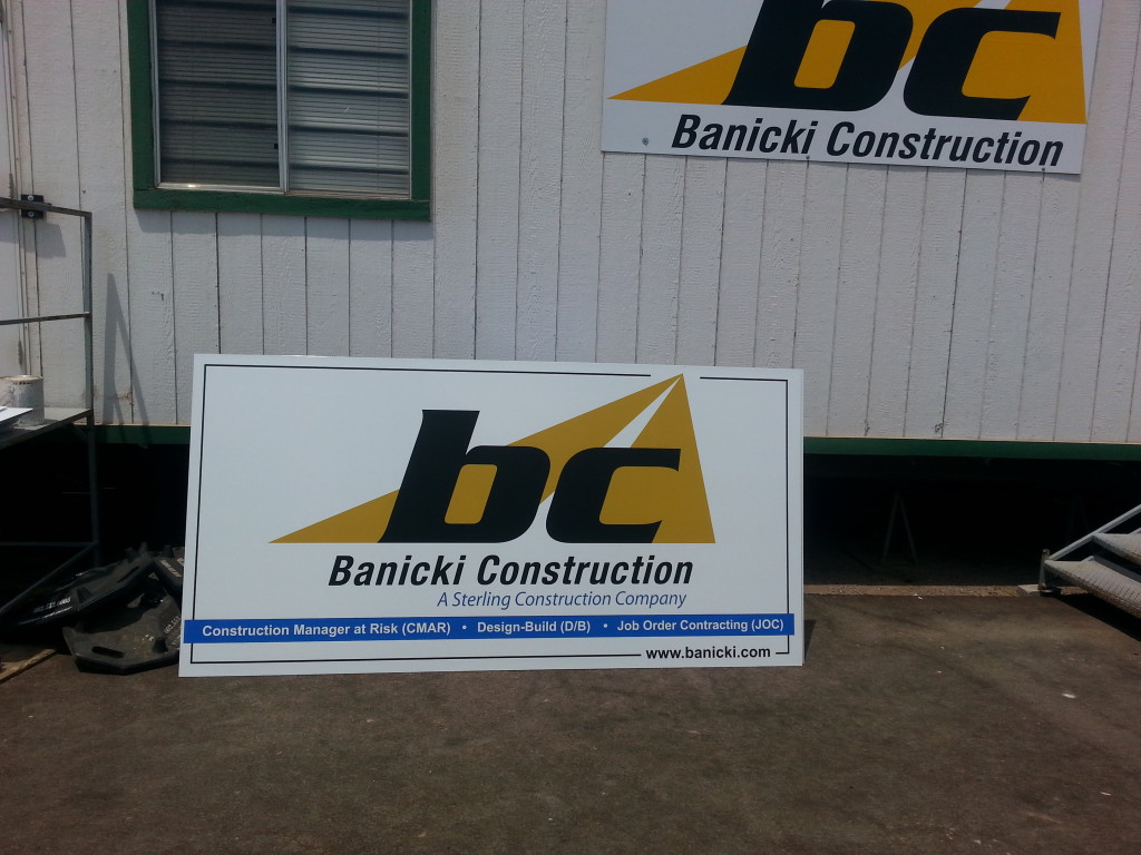 Construction signage printed on metal with UV coating to resist weathering